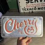Vintage Steel License Plate Vanity 1960-70 Booster Cherry 65 Show Car Corvette. Fixed Price $100.00.